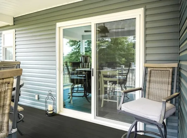 White two-lite sliding glass door onto a covered porch