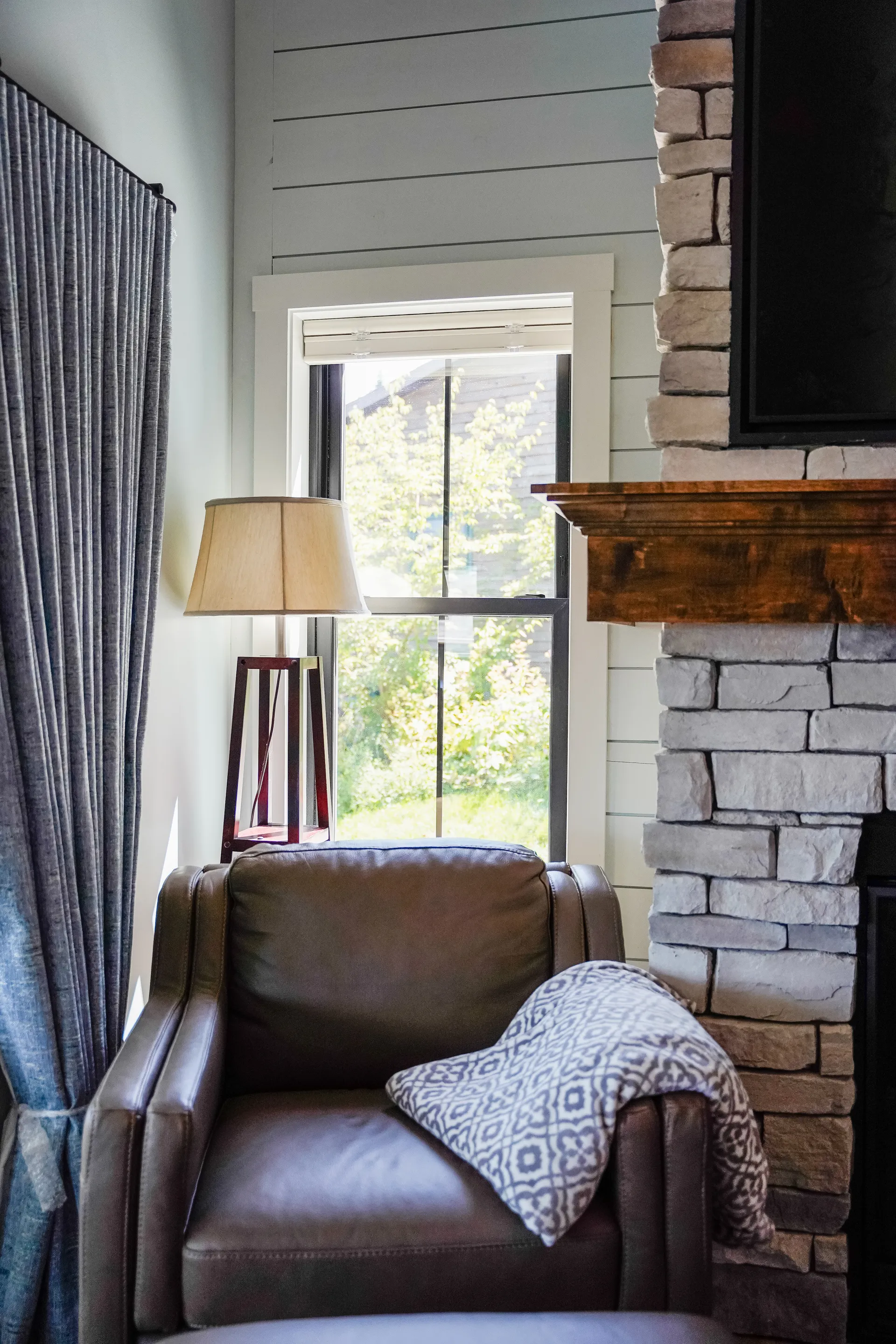 Cozy living room with a fireplace and large windows